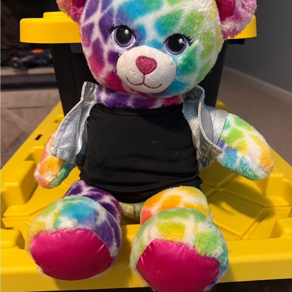 Build-A-Bear Workshop Rainbow Safari Bear plush toy wearing a silver vest